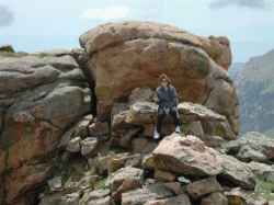 A close up shot of her on the rocks